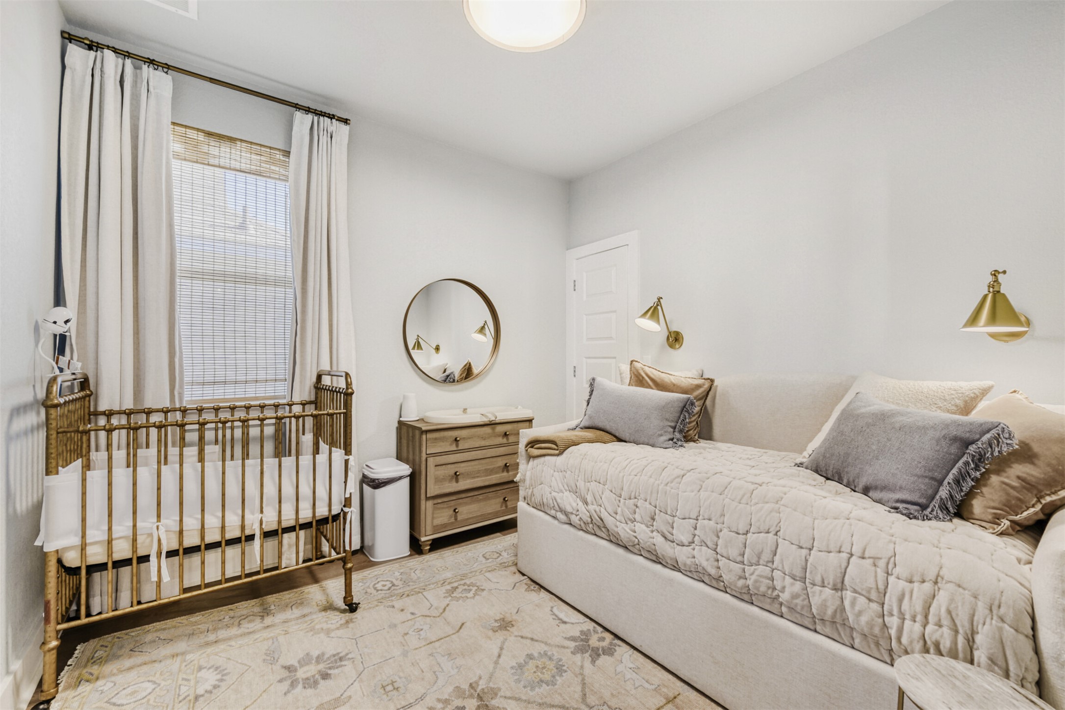 8602 Cottage Rose Drive Austin, TX 78744 - Photo 15 of 17 Bedroom featuring a crib