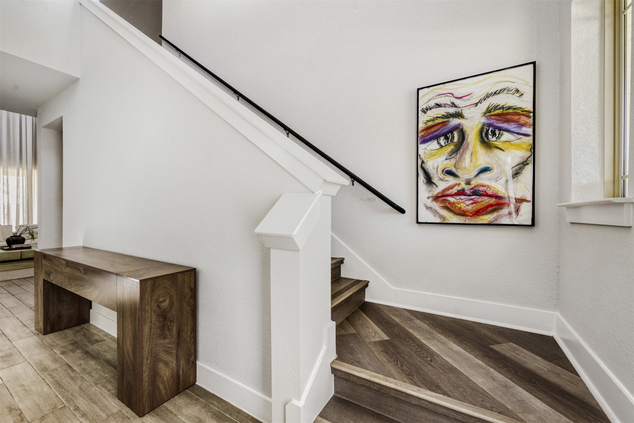 8602 Cottage Rose Drive Austin, TX 78744 - Photo 6 of 17 Staircase featuring wood finished floors and baseboards