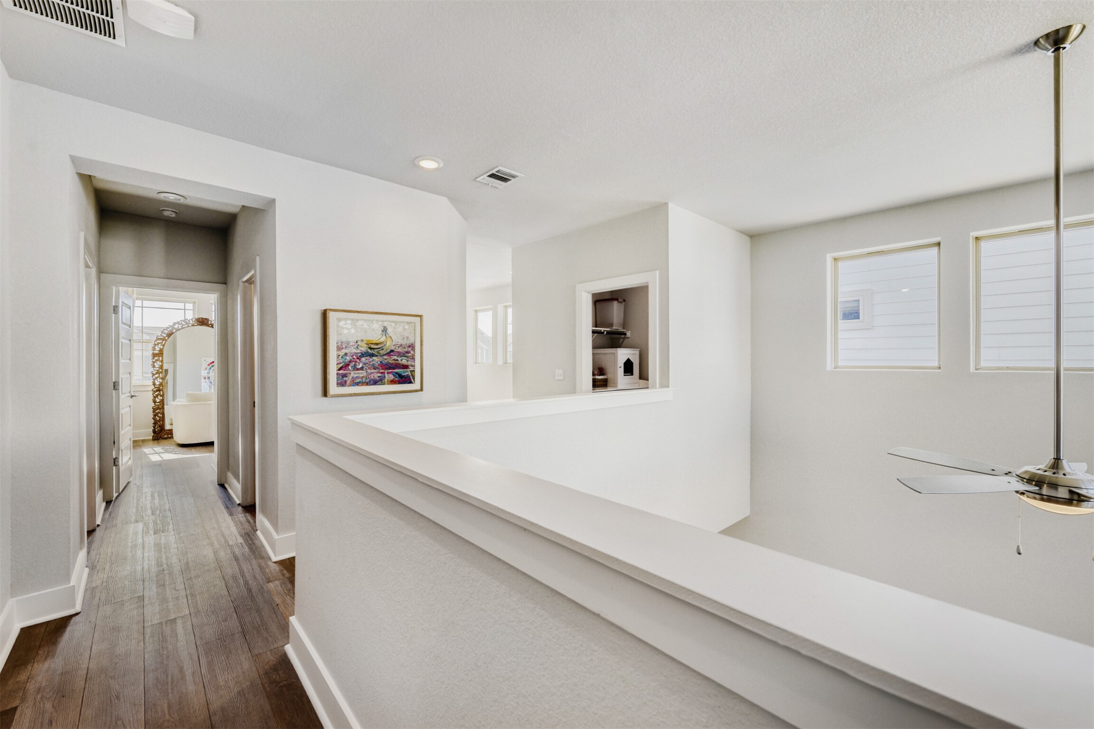 8602 Cottage Rose Drive Austin, TX 78744 - Photo 7 of 17 Hallway featuring dark wood-style floors and recessed lighting