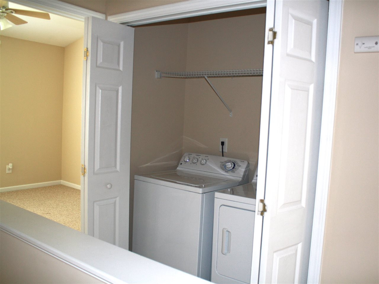8007 River Water Court Raleigh, NC 27616 - Photo 6 of 10 a utility room with dryer and washer