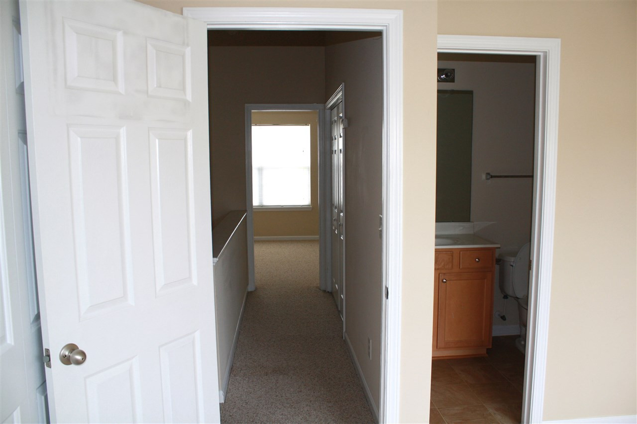 8007 River Water Court Raleigh, NC 27616 - Photo 7 of 10 a view of a bathroom from a hallway