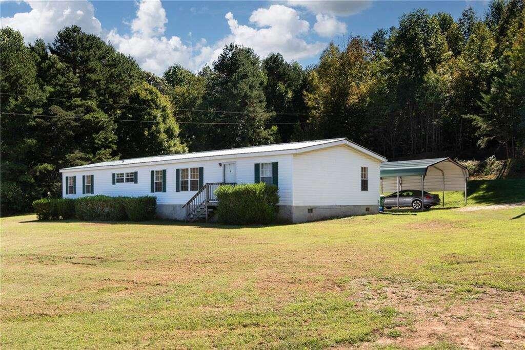 348 Daily Road Homer, GA 30547 - Photo 1 of 1 a front view of a house with yard and lake view