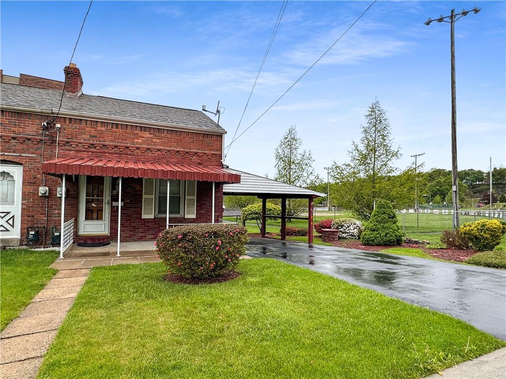 89 Thomas Street Crafton, PA 15205 - Photo 1 of 13 a front view of a house with garden