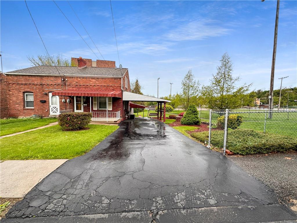 89 Thomas Street Crafton, PA 15205 - Photo 2 of 13 a view of a house with a yard
