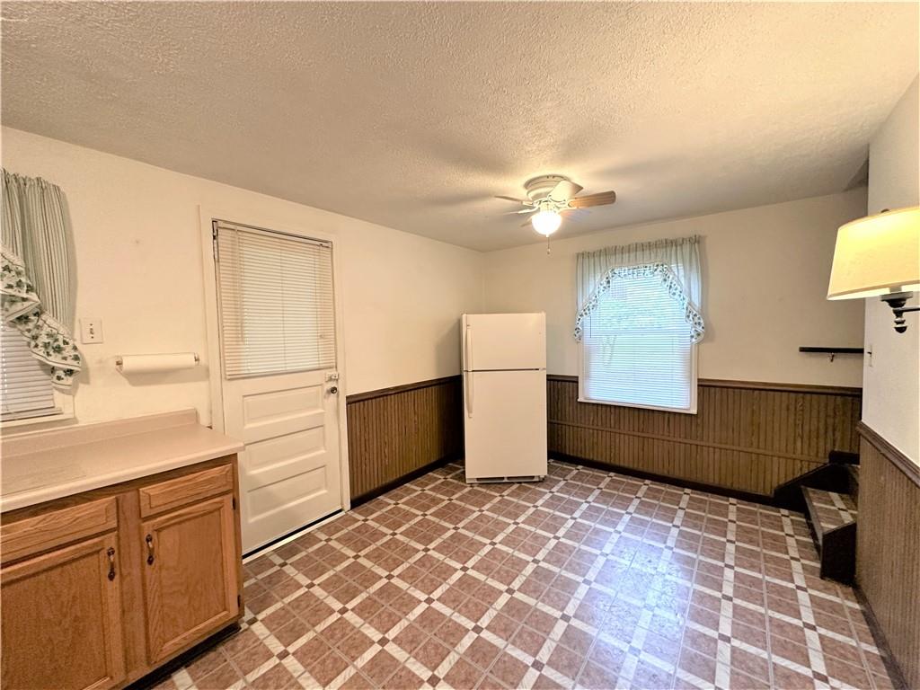 89 Thomas Street Crafton, PA 15205 - Photo 4 of 13 a living room with granite countertop furniture a sink and a window