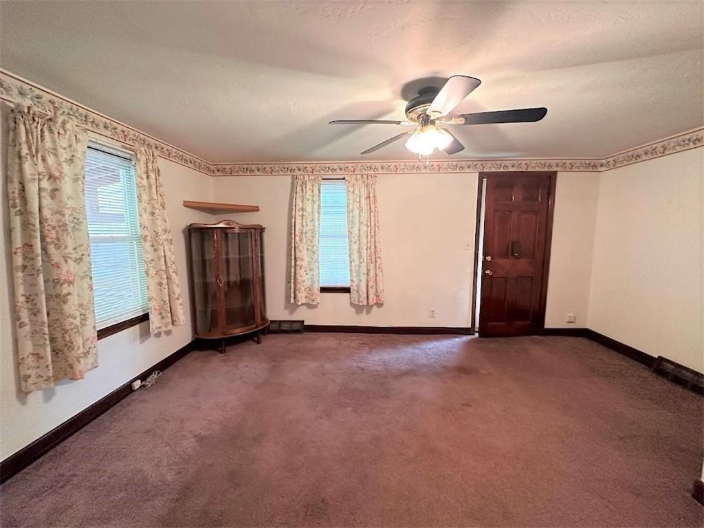 89 Thomas Street Crafton, PA 15205 - Photo 5 of 13 an empty room with windows and fan