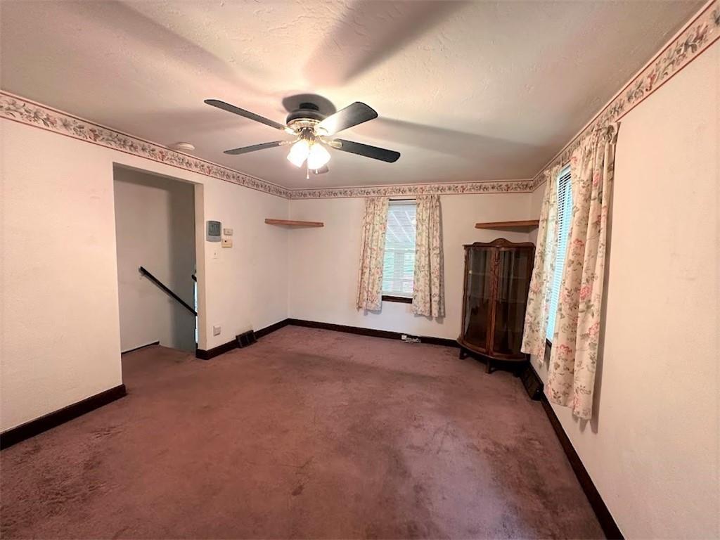 89 Thomas Street Crafton, PA 15205 - Photo 6 of 13 a view of a livingroom with a ceiling fan and window