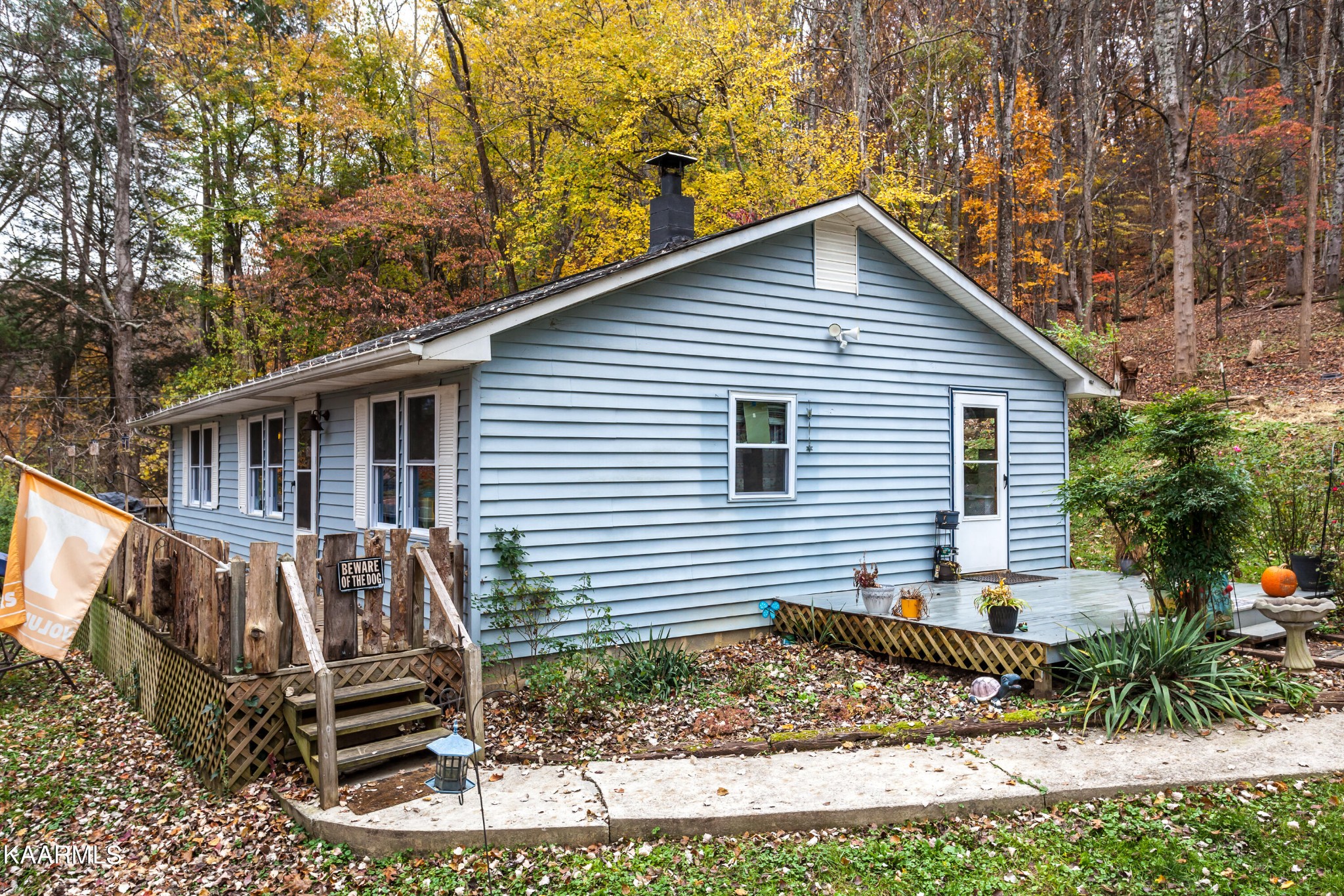 a view of a house with a yard chairs and couches