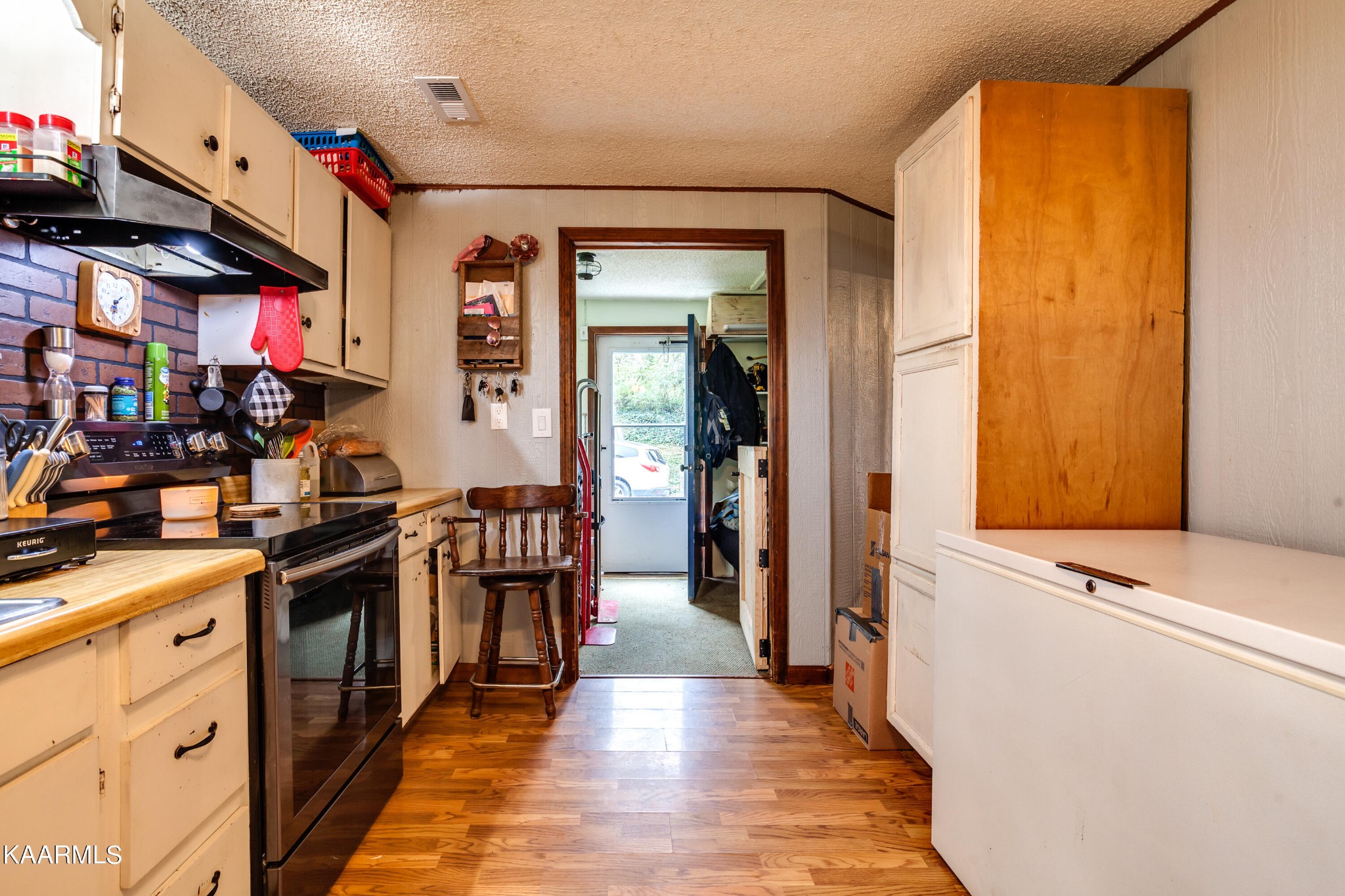 2018 Rhea Road Knoxville, TN 37920 - Photo 12 of 28 a view of a kitchen with cabinets and wooden floor
