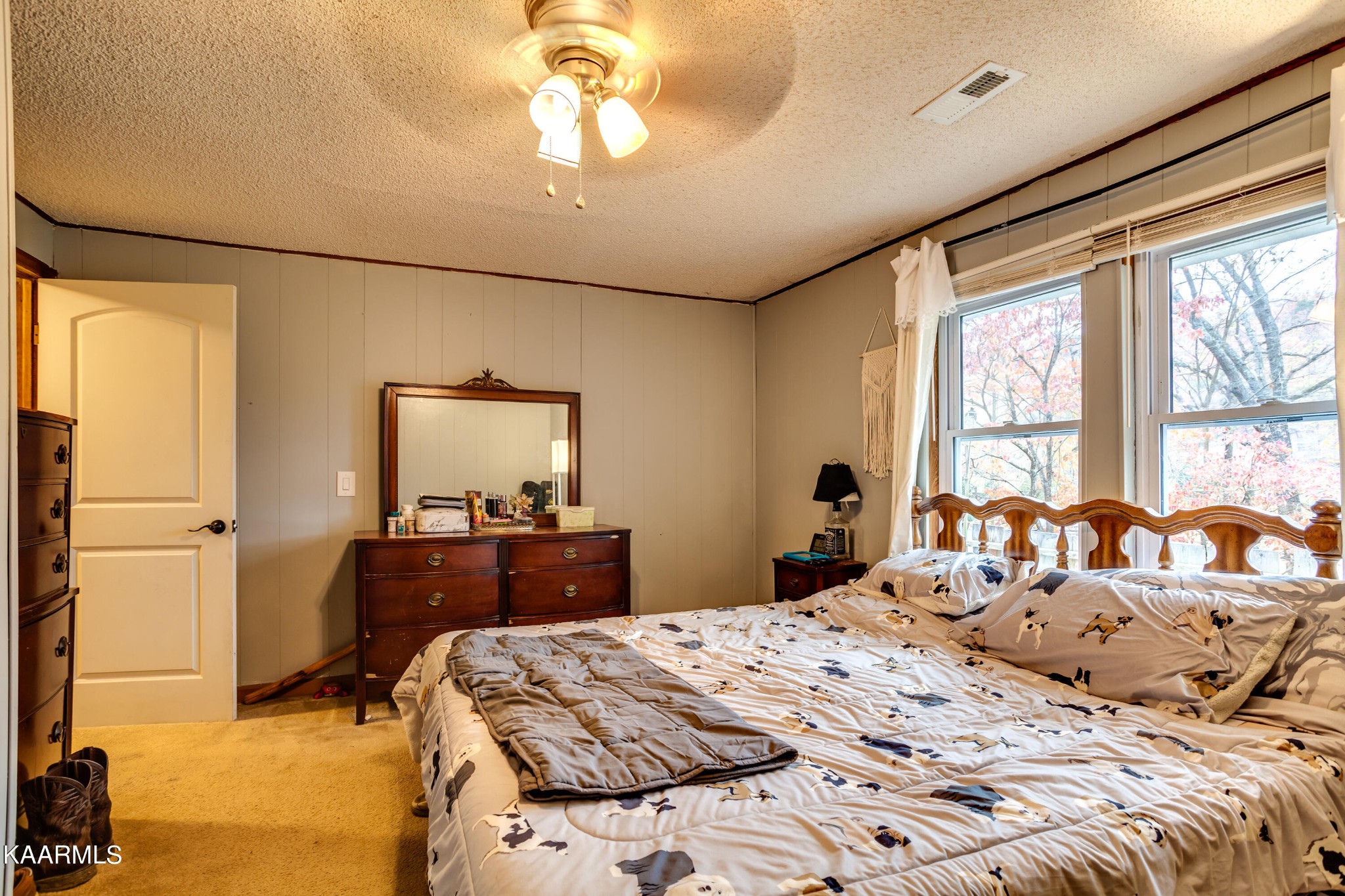 2018 Rhea Road Knoxville, TN 37920 - Photo 17 of 28 a bedroom with a bed and wooden floor