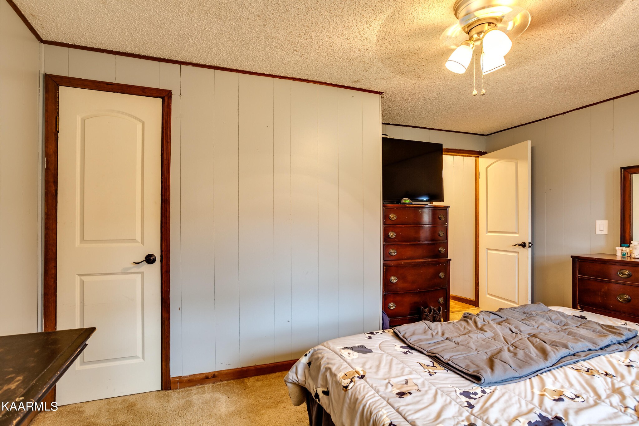 2018 Rhea Road Knoxville, TN 37920 - Photo 18 of 28 a bedroom with a bed and a chandelier