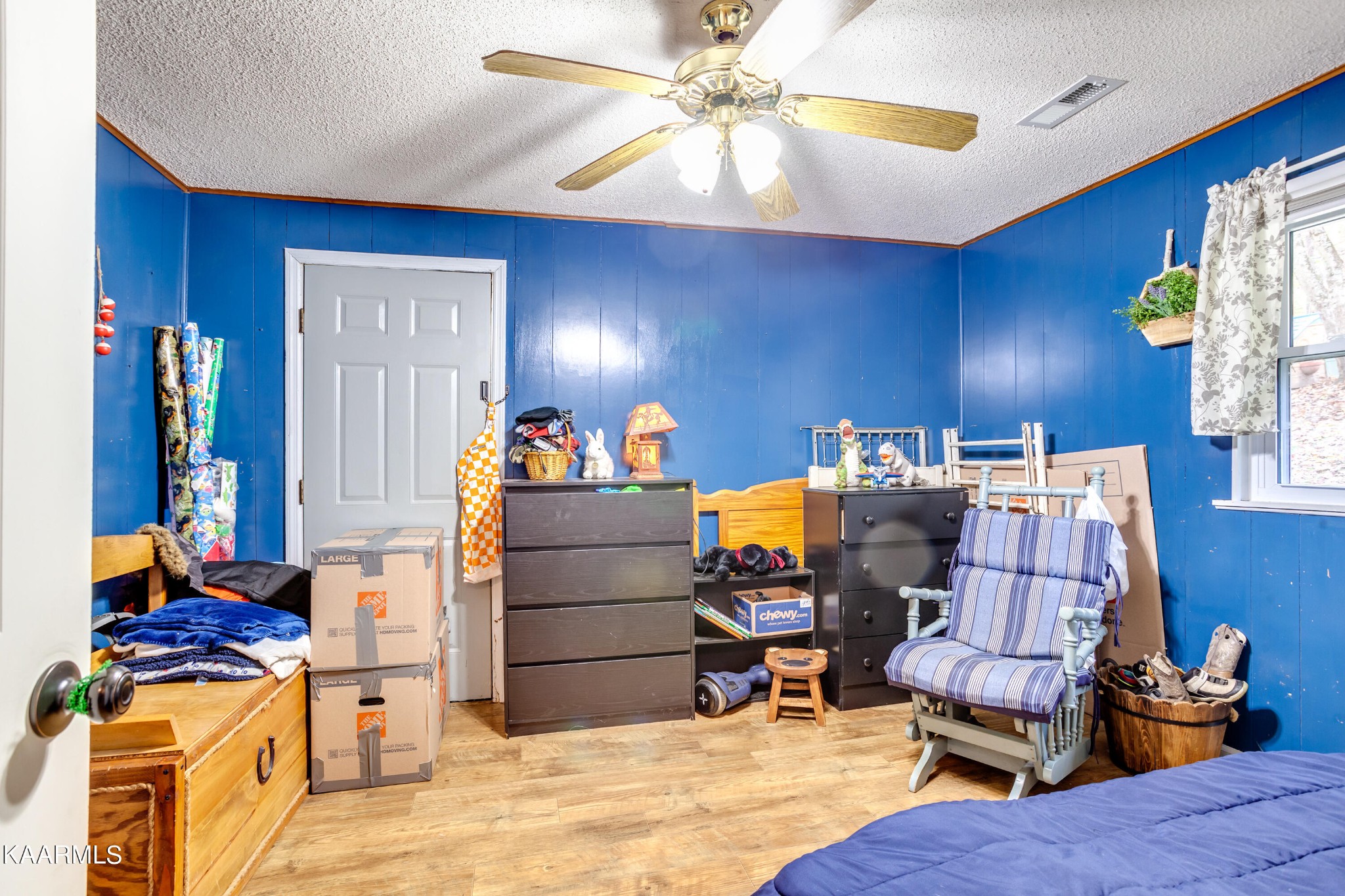 2018 Rhea Road Knoxville, TN 37920 - Photo 19 of 28 a bed room with a bed and a chandelier