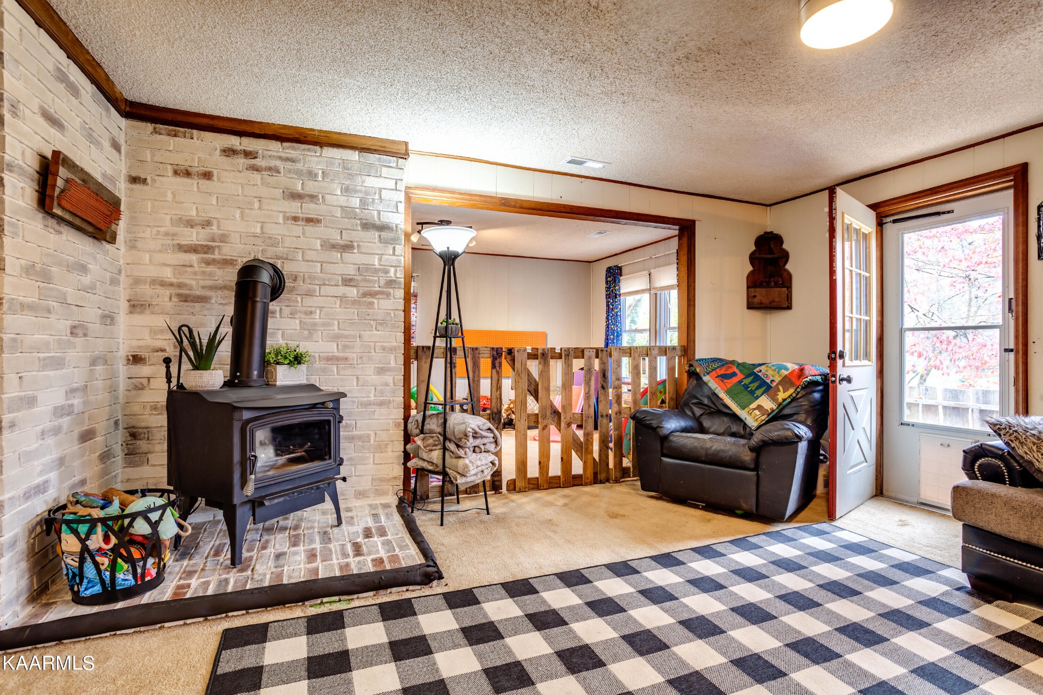 2018 Rhea Road Knoxville, TN 37920 - Photo 8 of 28 a living room with furniture a rug and a fireplace