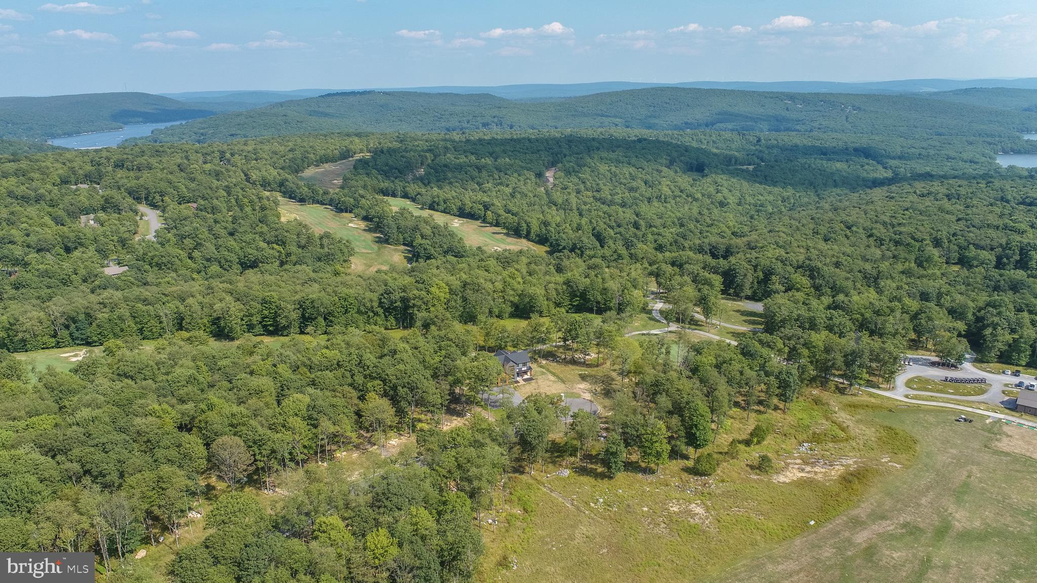 6 Irwin Way Oakland, MD 21550 - Photo 9 of 13 a view of a field with an ocean and mountain view