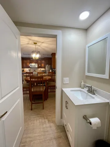 a spacious bathroom with a double vanity sink and a mirror