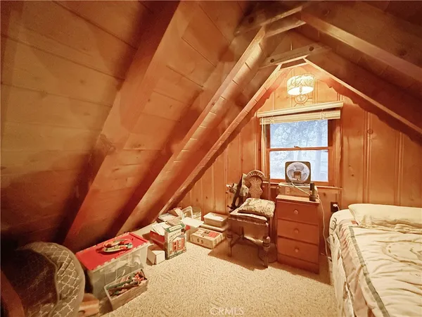 a bedroom with furniture and natural light