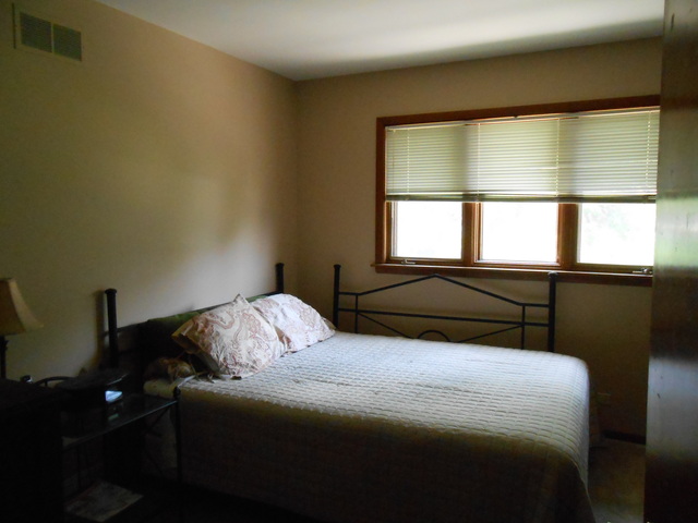 18363 Bock Road Lansing, IL 60438 - Photo 14 of 15 a bedroom with a bed and a window