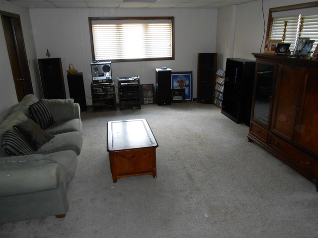 18363 Bock Road Lansing, IL 60438 - Photo 15 of 15 a living room with furniture and a flat screen tv