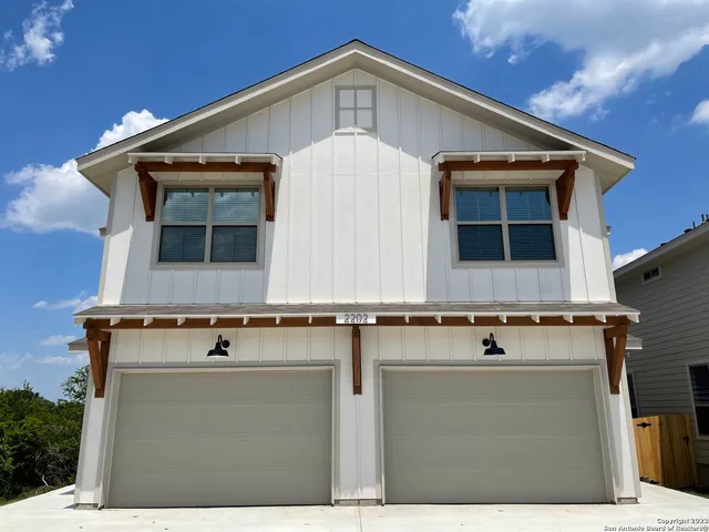 a front view of a house with garage