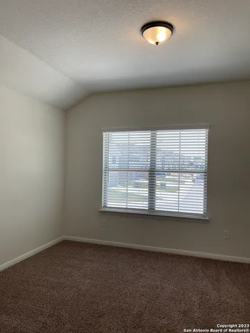 an empty room with closet area