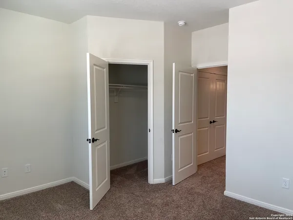 a view of a hallway with closet