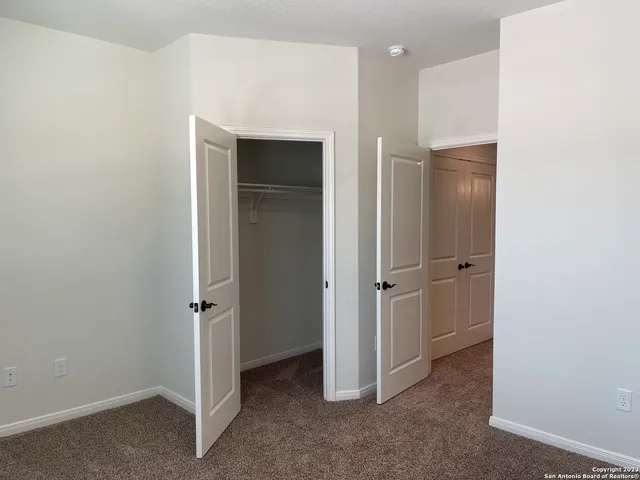 a view of a hallway with closet