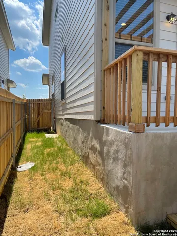 a view of a small house with roof deck