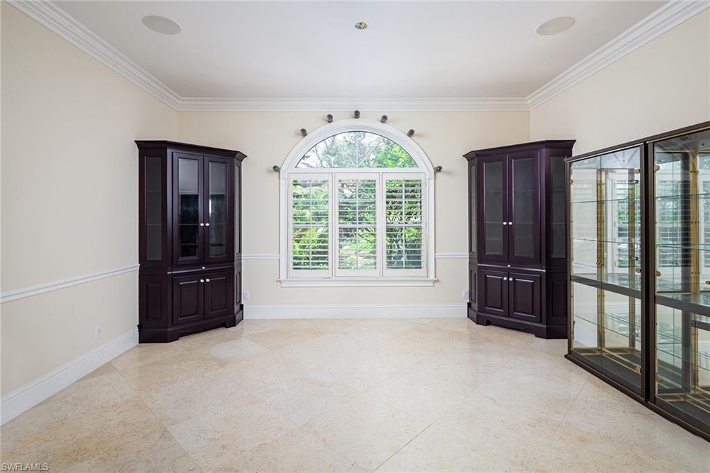 122 Caribbean Road Naples, FL 34108 - Photo 14 of 31 an empty room with windows and closet