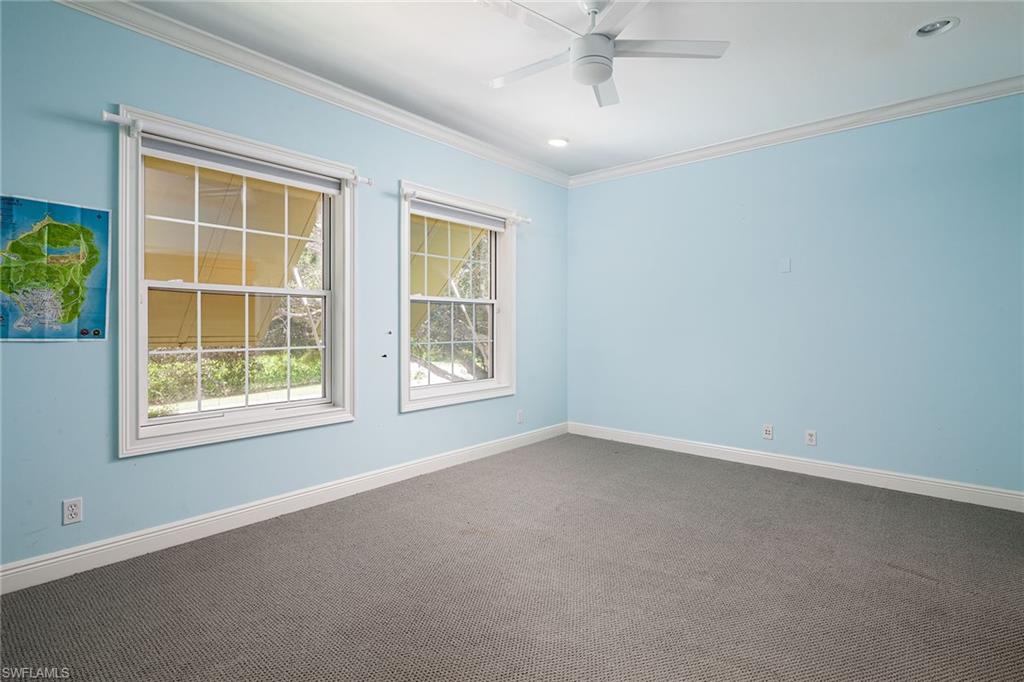 122 Caribbean Road Naples, FL 34108 - Photo 15 of 31 an empty room with a window
