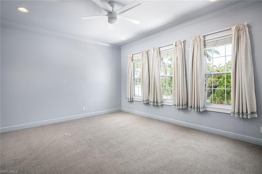 122 Caribbean Road Naples, FL 34108 - Photo 17 of 31 an empty room with a empty space and windows
