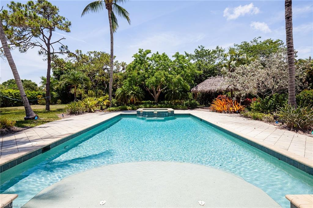 122 Caribbean Road Naples, FL 34108 - Photo 7 of 31 a view of a backyard