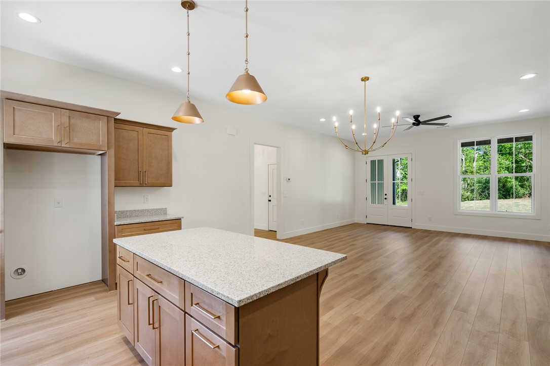 2125 A Honea Path Park Road Anderson, SC 29625 - Photo 26 of 26 This spacious kitchen and living area feature an open floor plan with ample natural light.
