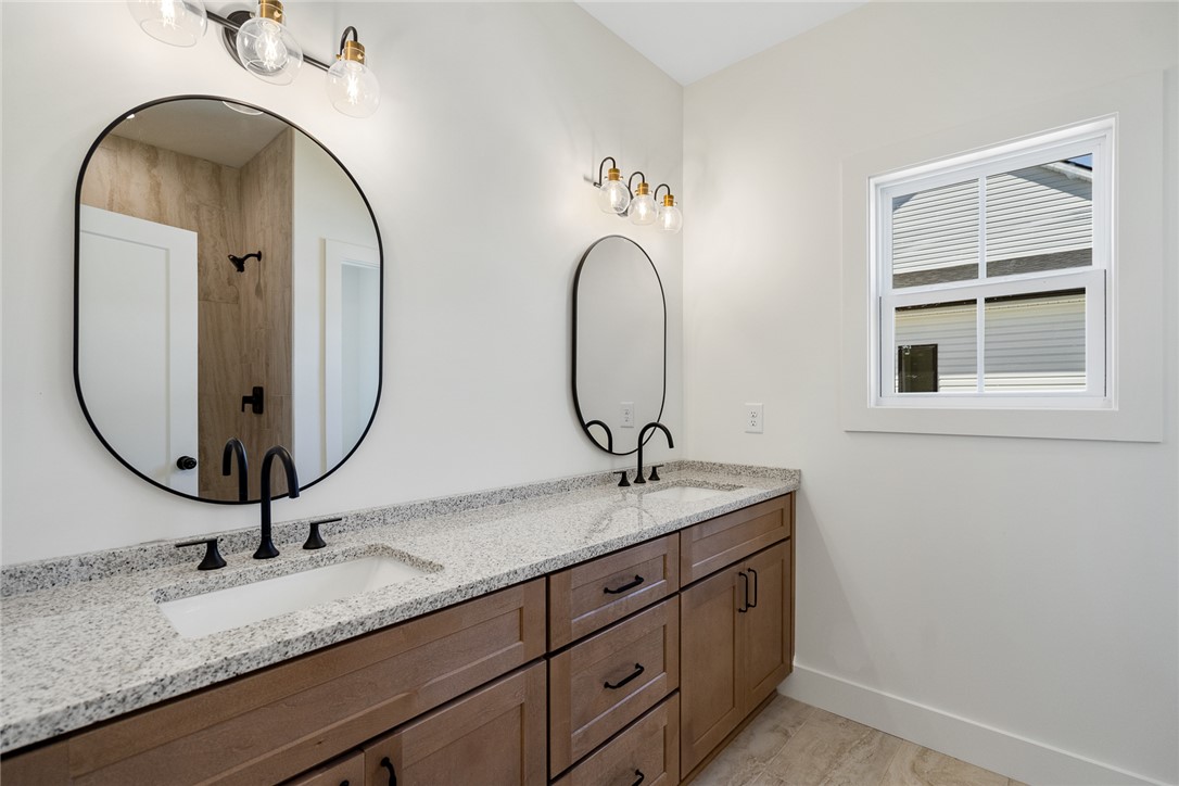 2125 A Honea Path Park Road Anderson, SC 29625 - Photo 14 of 26 This primary bathroom features a dual vanity, granite counters, and a modern design.