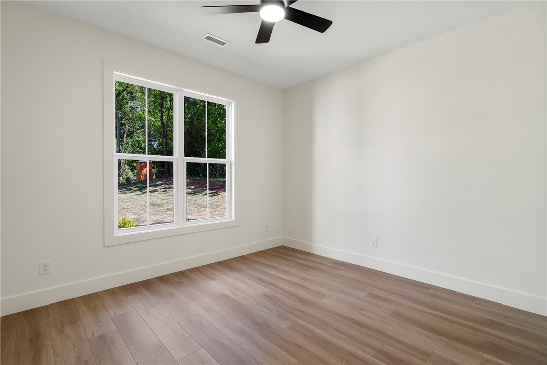2125 A Honea Path Park Road Anderson, SC 29625 - Photo 19 of 26 This bright room features a large window, offering abundant natural light and views of the surrounding greenery.