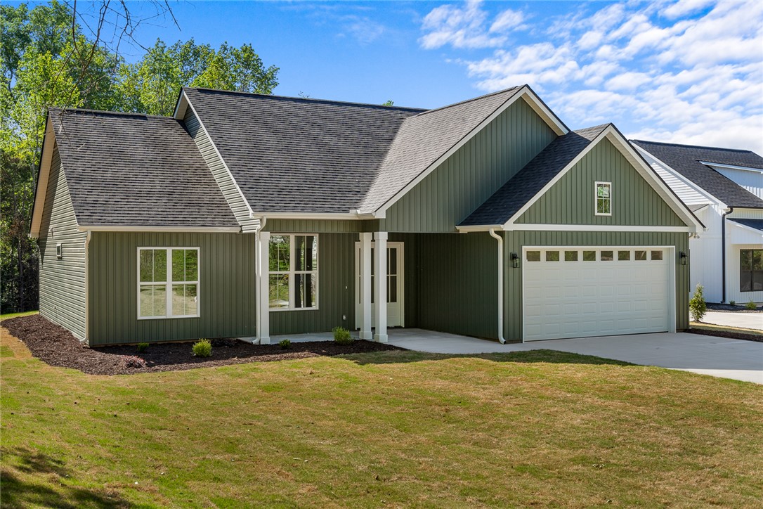 2125 A Honea Path Park Road Anderson, SC 29625 - Photo 3 of 26 This charming home offers curb appeal with its green siding and white trim.