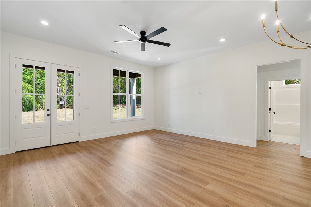 2125 A Honea Path Park Road Anderson, SC 29625 - Photo 6 of 26 Bright, spacious room featuring natural wood flooring and ample natural light.