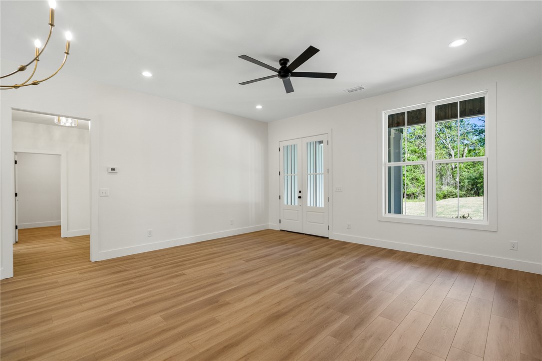 2125 A Honea Path Park Road Anderson, SC 29625 - Photo 7 of 26 Bright and airy interior with elegant wood flooring and French doors.