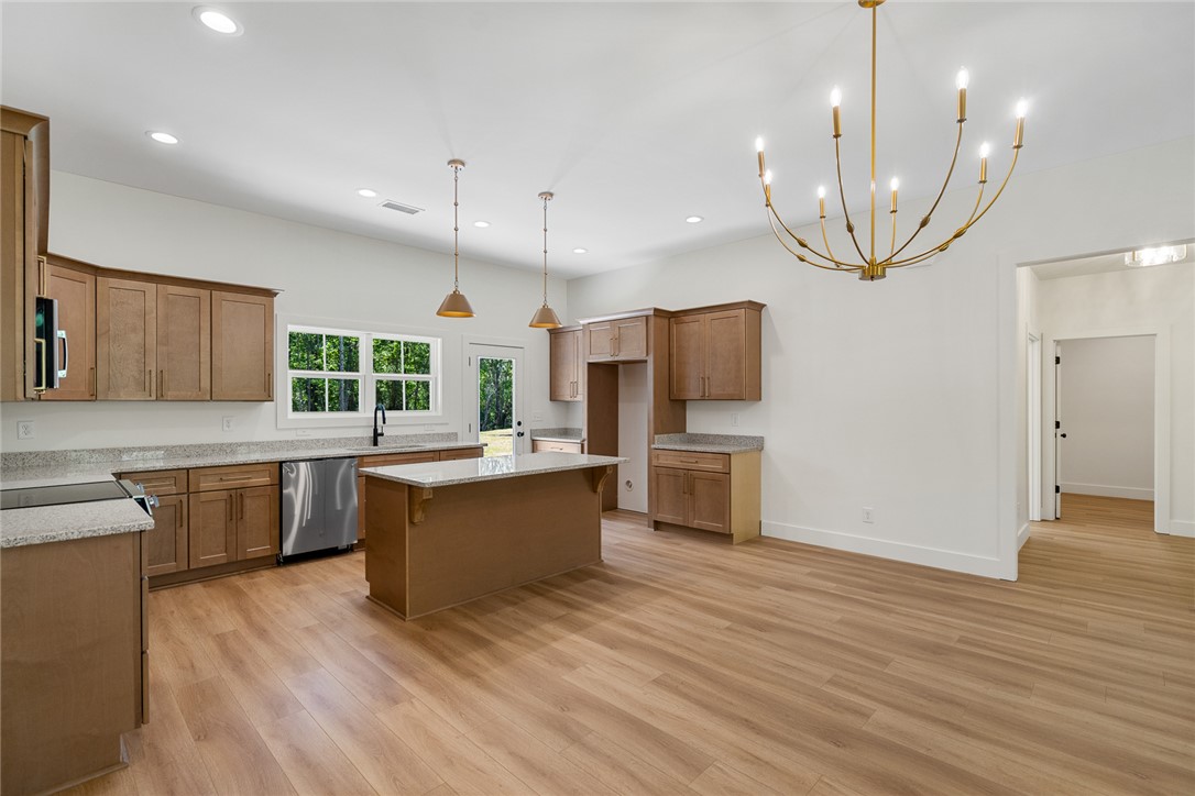 2125 A Honea Path Park Road Anderson, SC 29625 - Photo 8 of 26 This spacious kitchen offers a central island, ample cabinetry, and direct outdoor access.