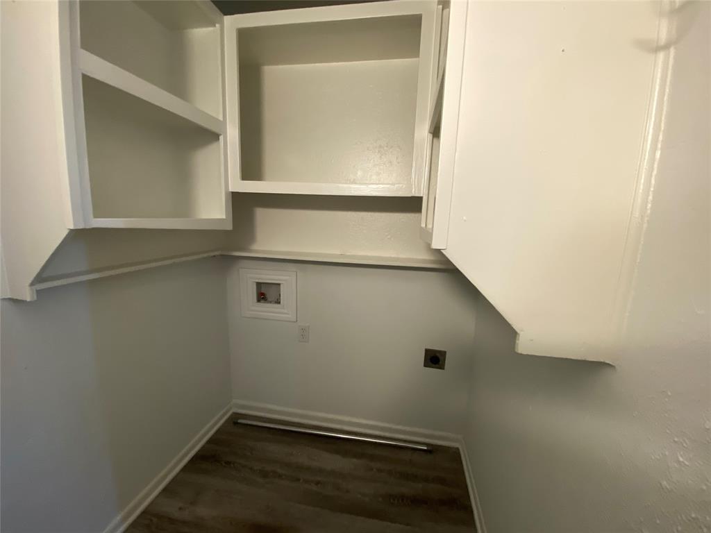 425 Wanda Way Hurst, TX 76053 - Photo 5 of 10 White upper cabinetry, wood-finish flooring, and white walls