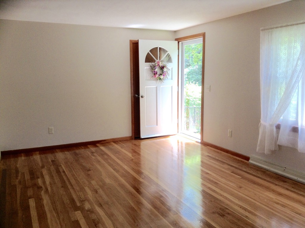 1135 Burts Pit Road Northampton, MA 01062 - Photo 5 of 10 a view of a livingroom with wooden floor and window