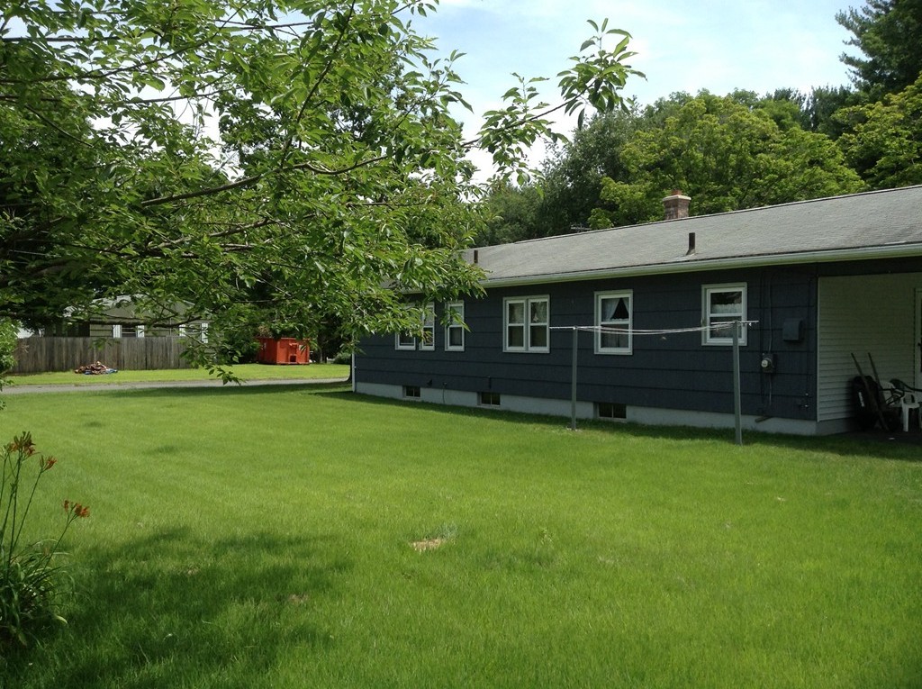 1135 Burts Pit Road Northampton, MA 01062 - Photo 10 of 10 a view of a house with backyard and a tree