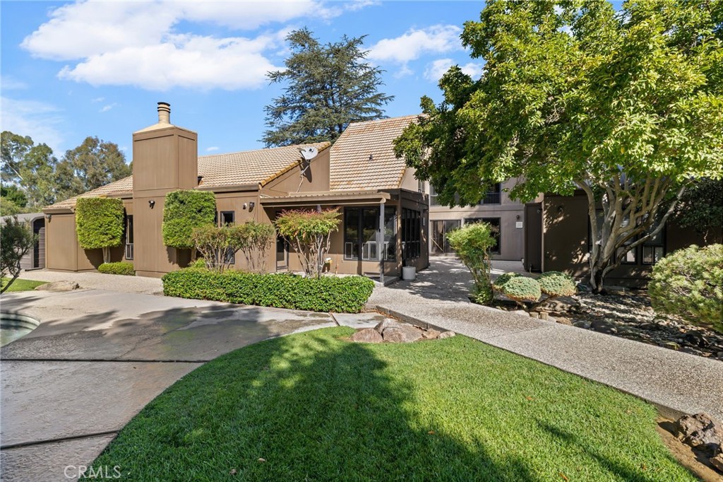 6357 County Road 48 Willows, CA 95988 - Photo 1 of 75 a front view of a house with garden and porch