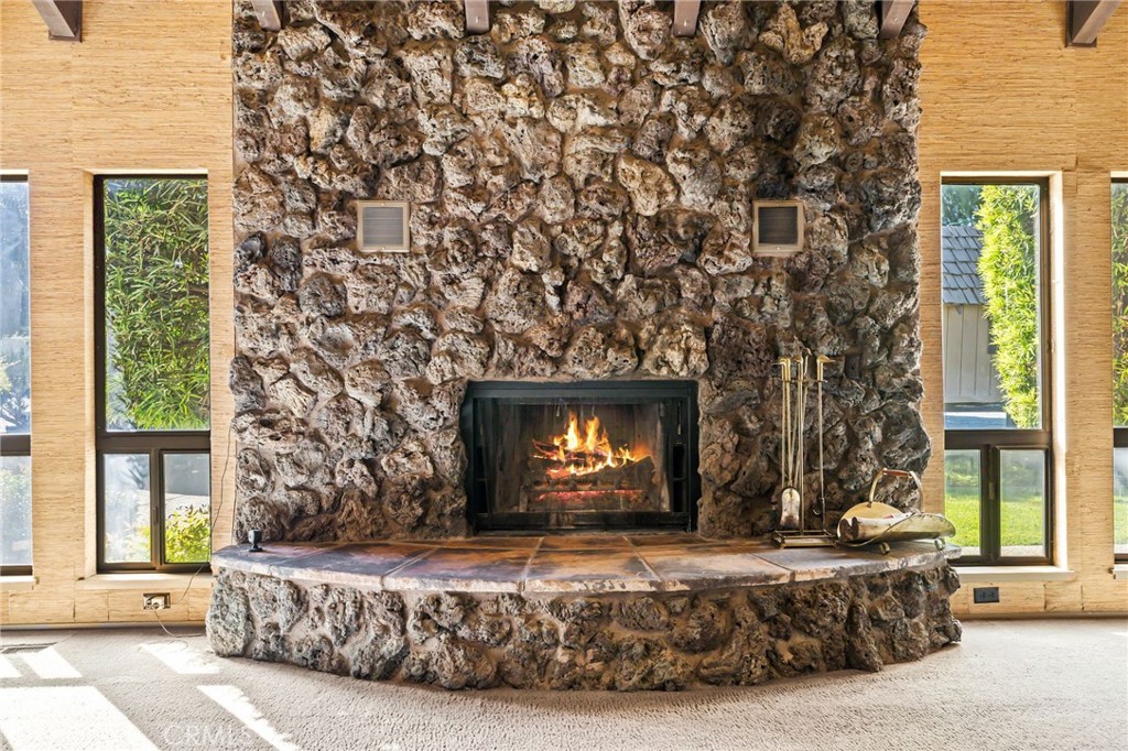 6357 County Road 48 Willows, CA 95988 - Photo 15 of 75 a living room with a couch a fireplace and a large window