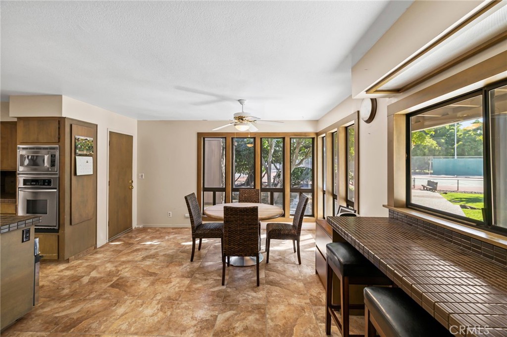 6357 County Road 48 Willows, CA 95988 - Photo 22 of 75 a view of a dining room with furniture large windows and wooden floor