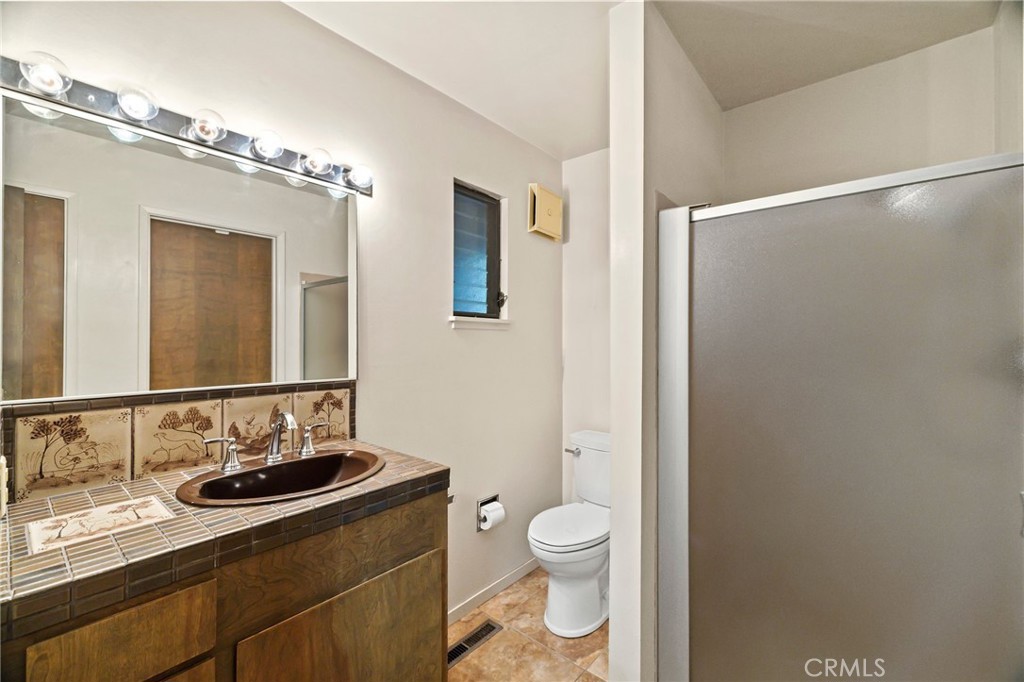 6357 County Road 48 Willows, CA 95988 - Photo 25 of 75 a bathroom with a sink and a mirror