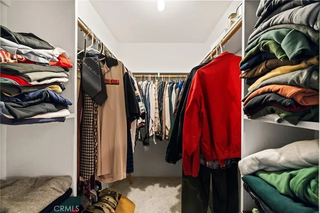 a view of a fence and trees in the background