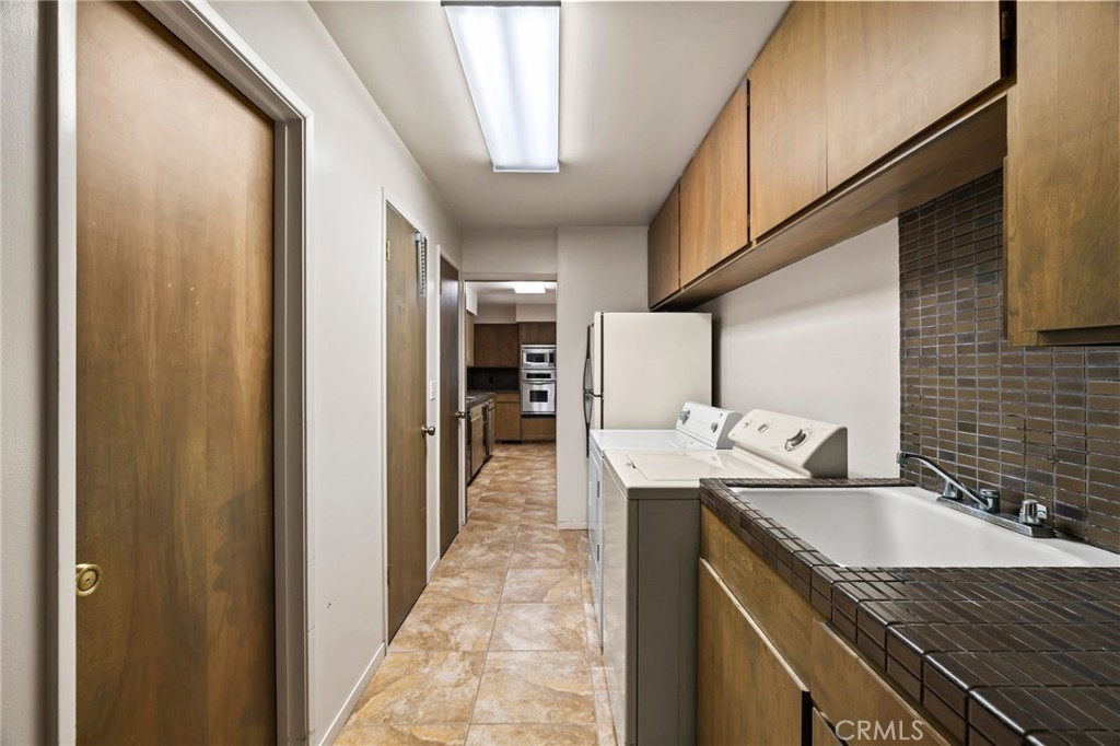 6357 County Road 48 Willows, CA 95988 - Photo 43 of 75 a kitchen with granite countertop a sink and cabinets