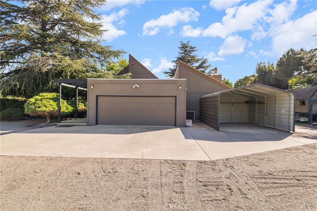 6357 County Road 48 Willows, CA 95988 - Photo 50 of 75 a front view of a house with a yard and garage