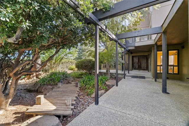 a view of a bedroom with furniture and the window