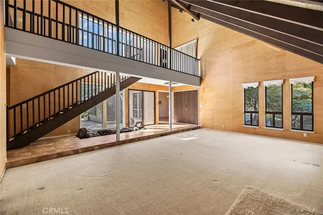 a view of a livingroom with furniture and a fireplace